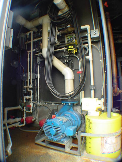 400-ton chiller interior showing pump motor refrigerant piping and electrical conduit