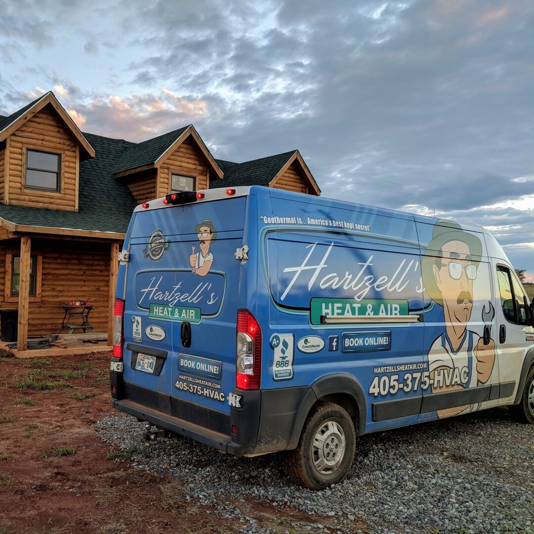 Hartzell’s Heat & Air service van at a new construction log home install in Oklahoma