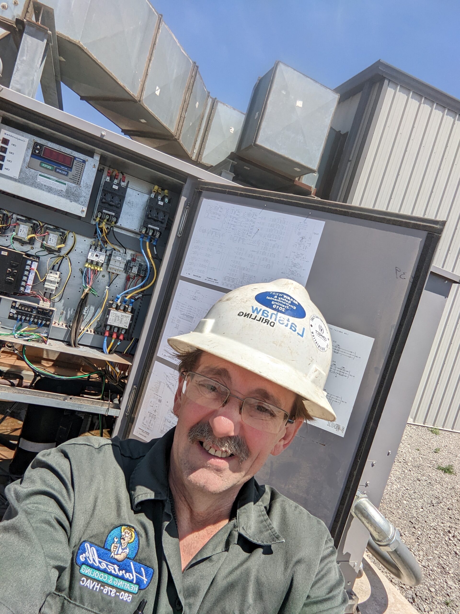 Dave Hartzell servicing commercial HVAC control panel at Oklahoma gas processing facility