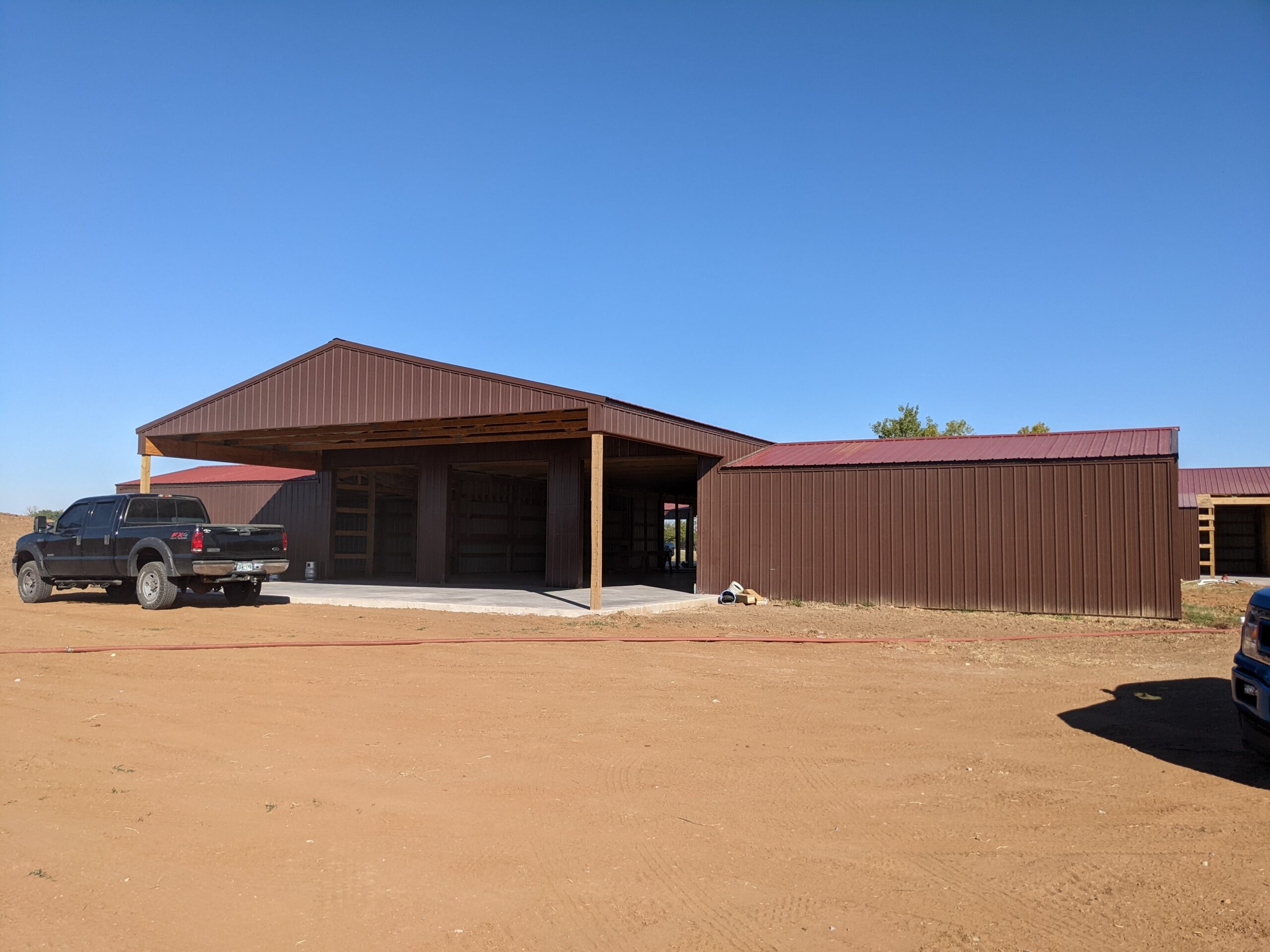 Hartzell's Heat & Air truck at new barndominium construction site