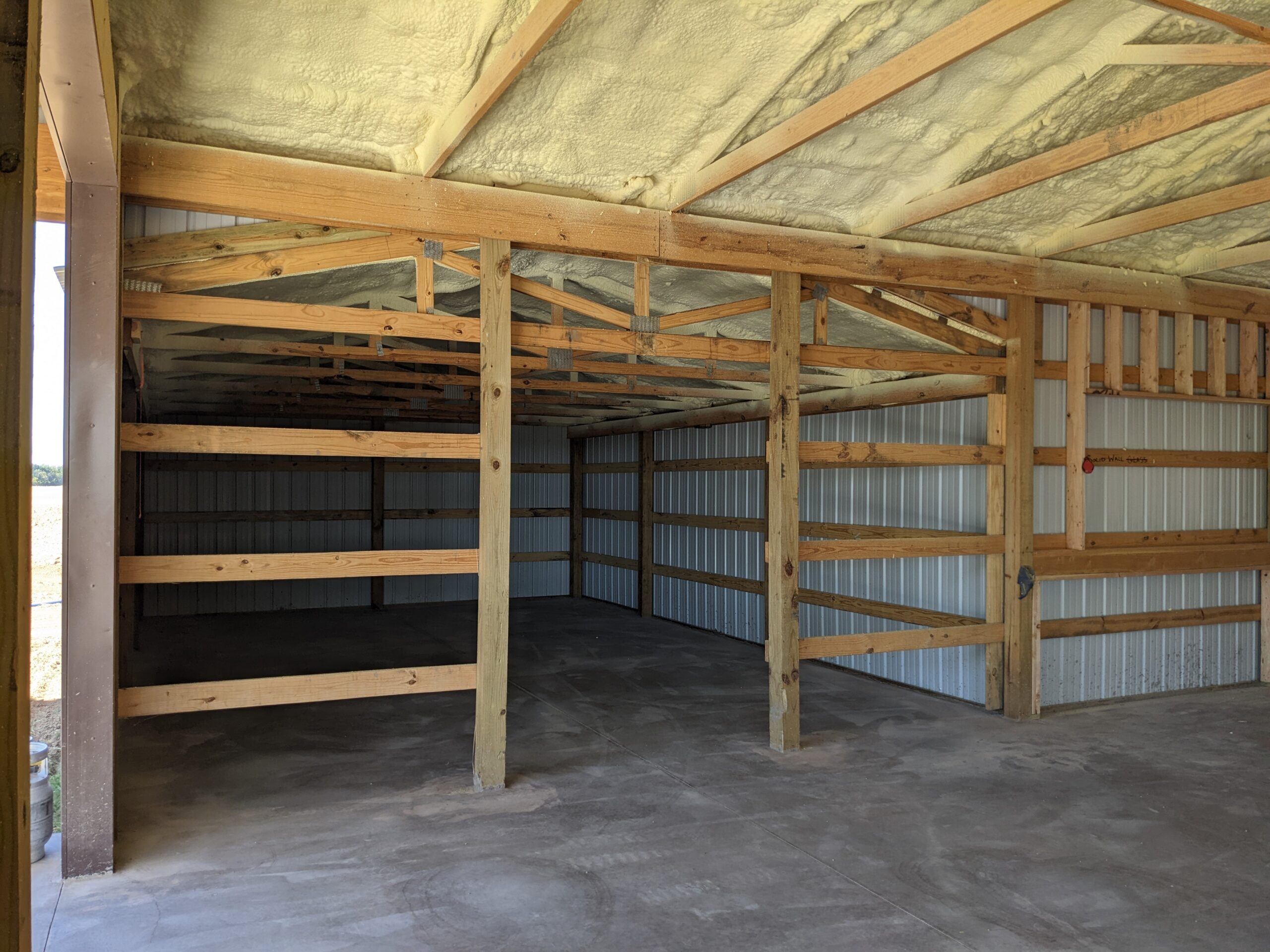 Spray foam insulation on barndominium ceiling — new construction HVAC