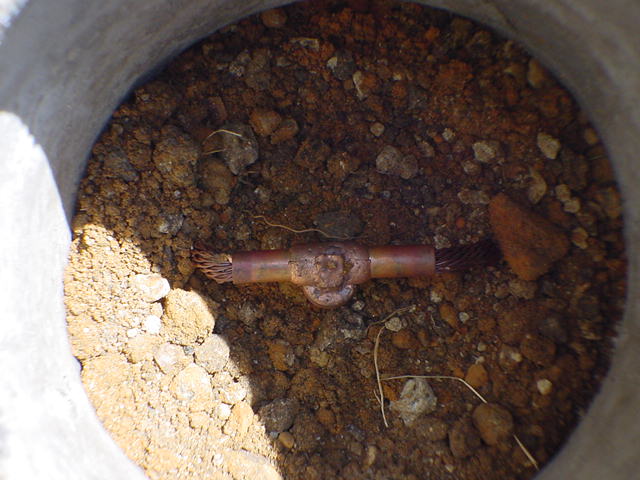 Concrete access vault showing buried copper cadweld connection in completed lightning protection ground ring