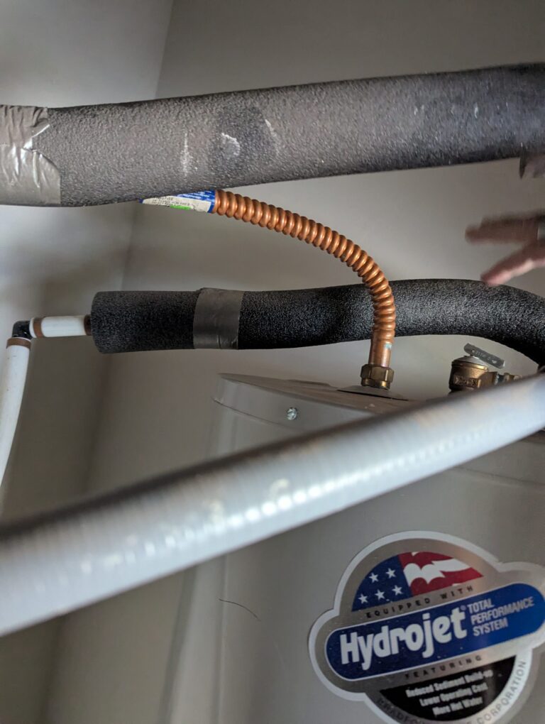 Geothermal desuperheater copper coil connection to water heater for free hot water in Oklahoma