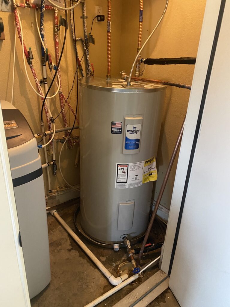 Bradford White electric water heater installed in a mechanical room