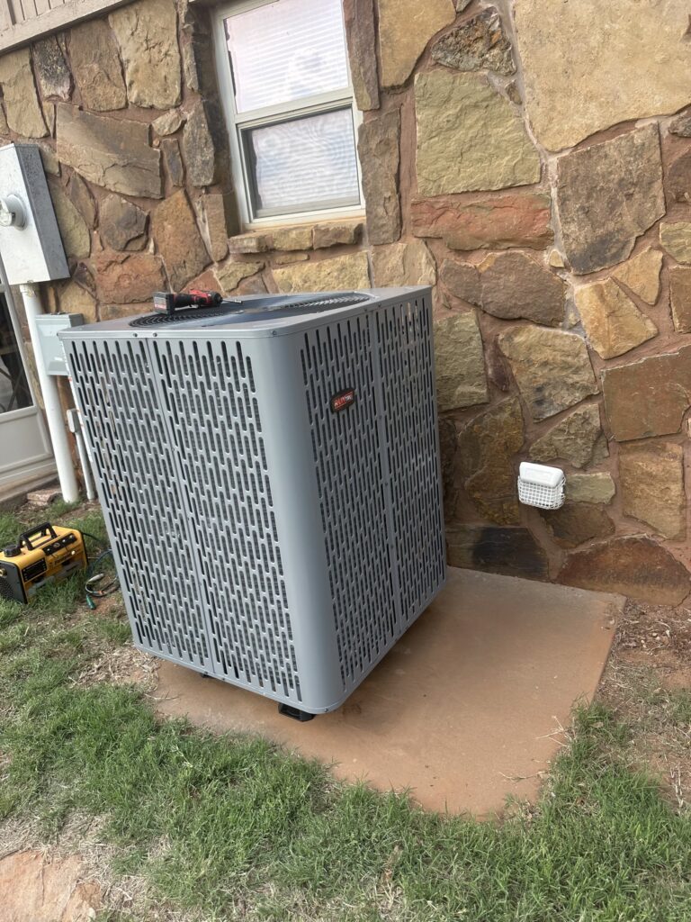 RunTru by Trane condenser at a stone-exterior home