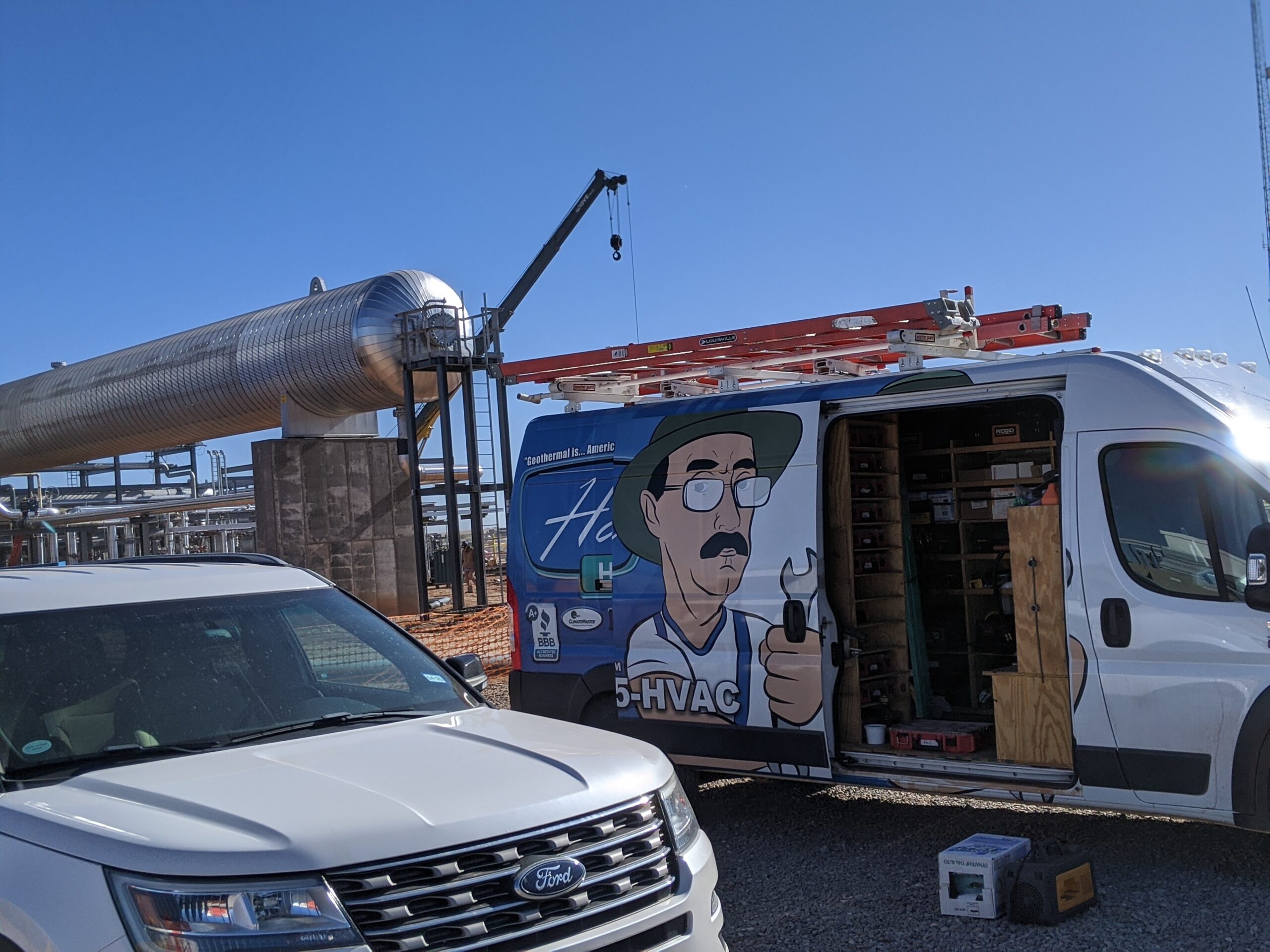 Hartzell's van at industrial gas facility with crane and stainless piping Oklahoma