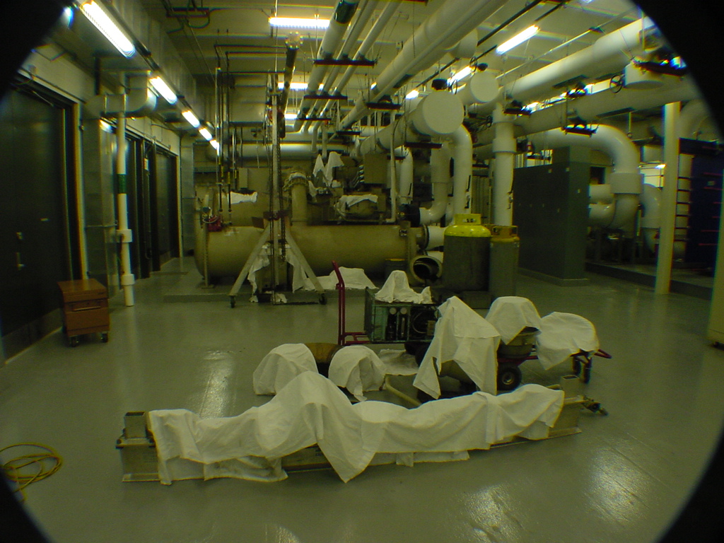 McQuay centrifugal chiller at Sprint data center plant room with components laid out for full teardown and rebuild