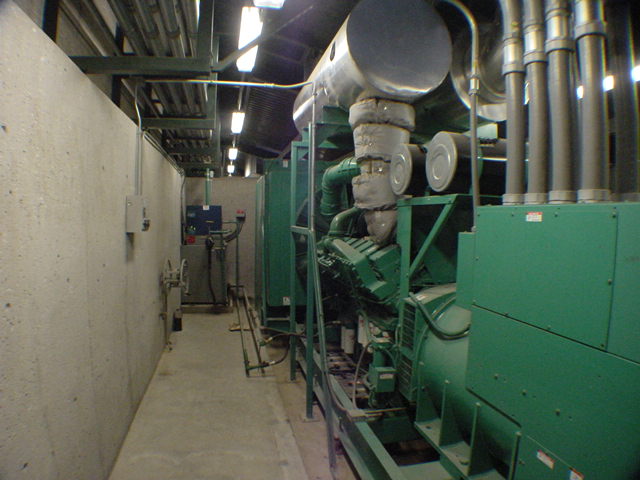 Multiple large Cummins generator sets in generator room at commercial data center PMA