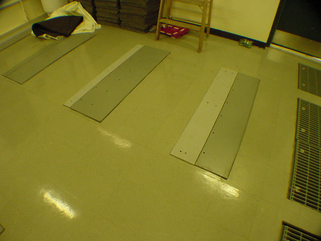 Raised floor perforated cooling tiles for cold air distribution in data center battery room