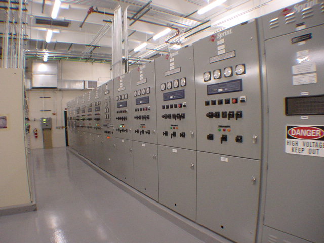 Completed Sprint electrical switchgear room with full row of branded panels danger high voltage signs