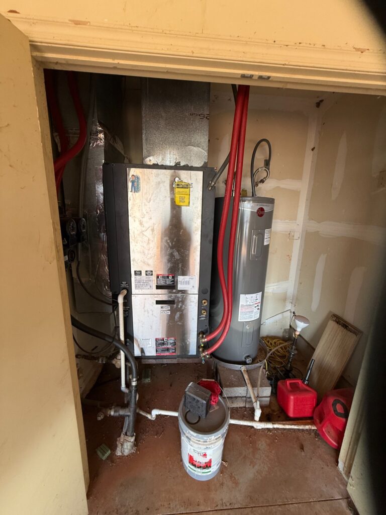 ClimateMaster geothermal heat pump with Rheem water heater and loop piping, Hartzell's install