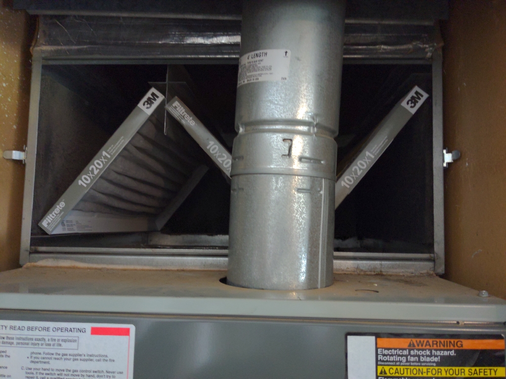 Furnace vent pipe installation in mechanical room
