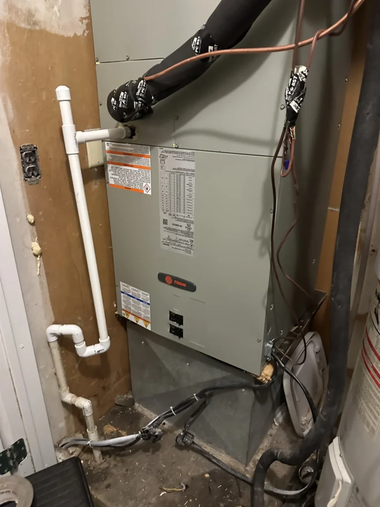 Trane air handler and coil in a Kingfisher utility closet