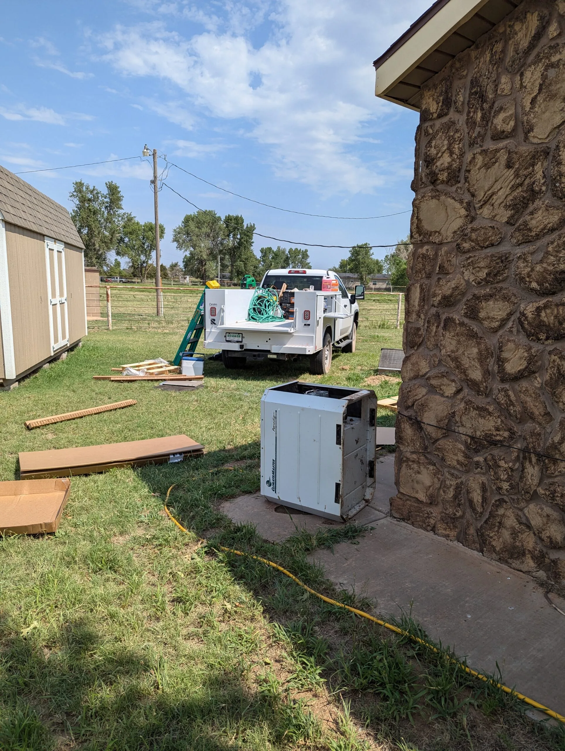 New HVAC system being installed at Oklahoma rural home by Hartzell technician