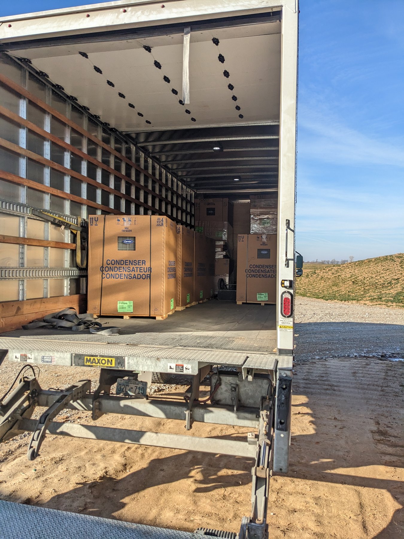 Carrier commercial condensing units being delivered on a box truck for the new HVAC system at The Cedar Gate event venue near Loyal, Oklahoma, installed by Hartzell's Heat and Air