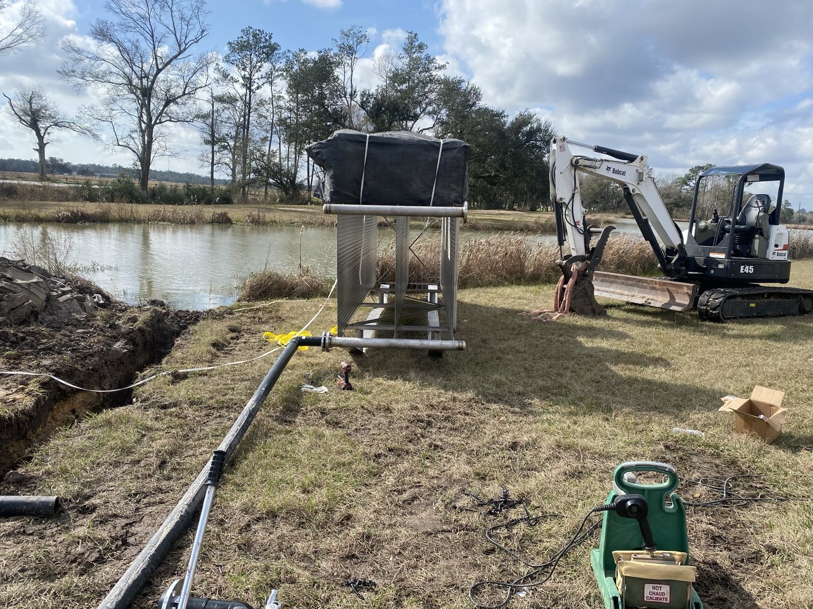 Geothermal pond loop piping and site conditions.