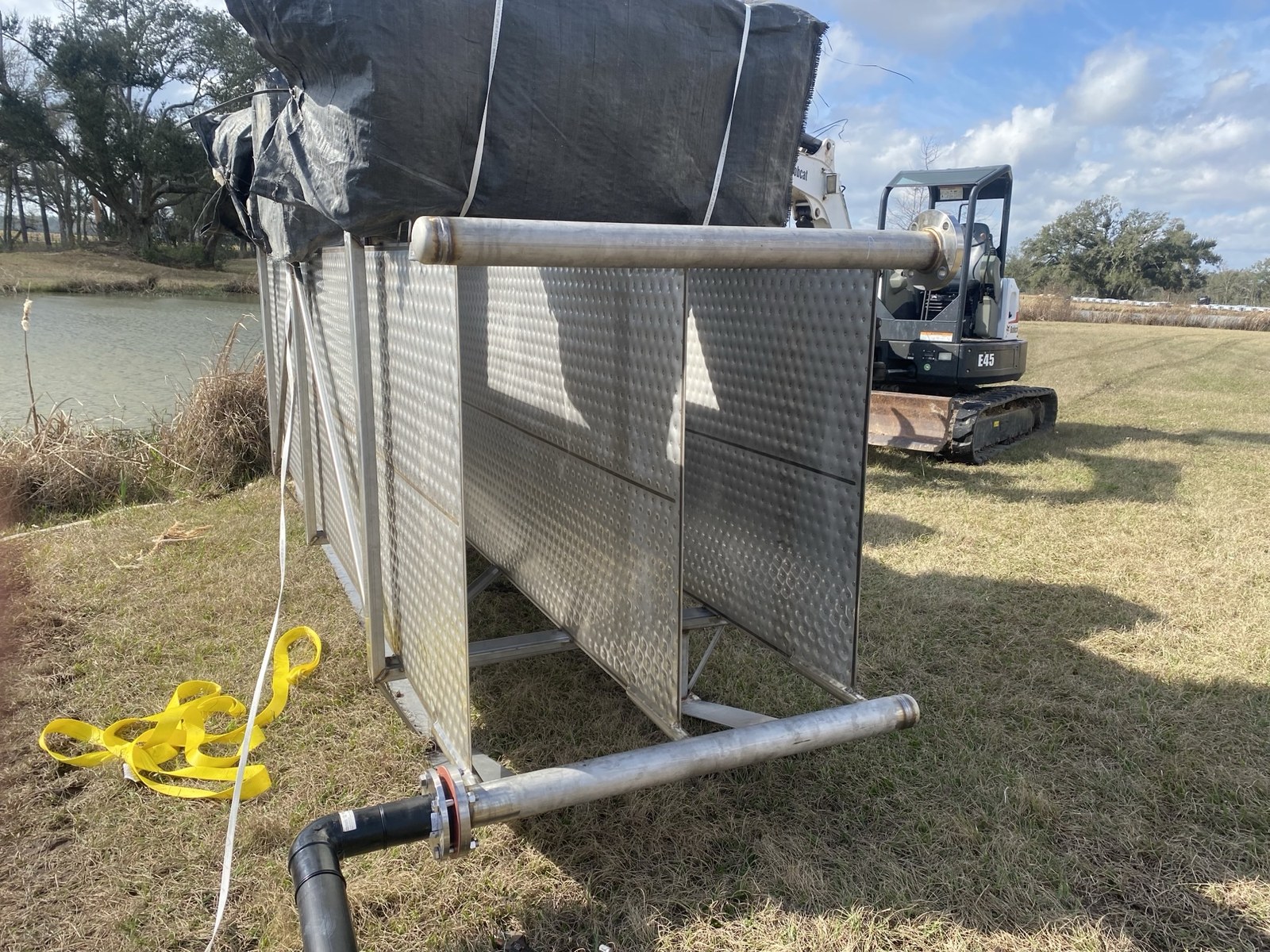 Geothermal pond loop piping and site conditions.