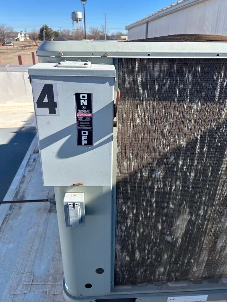 Rooftop condenser and electrical disconnect on an Oklahoma strip center