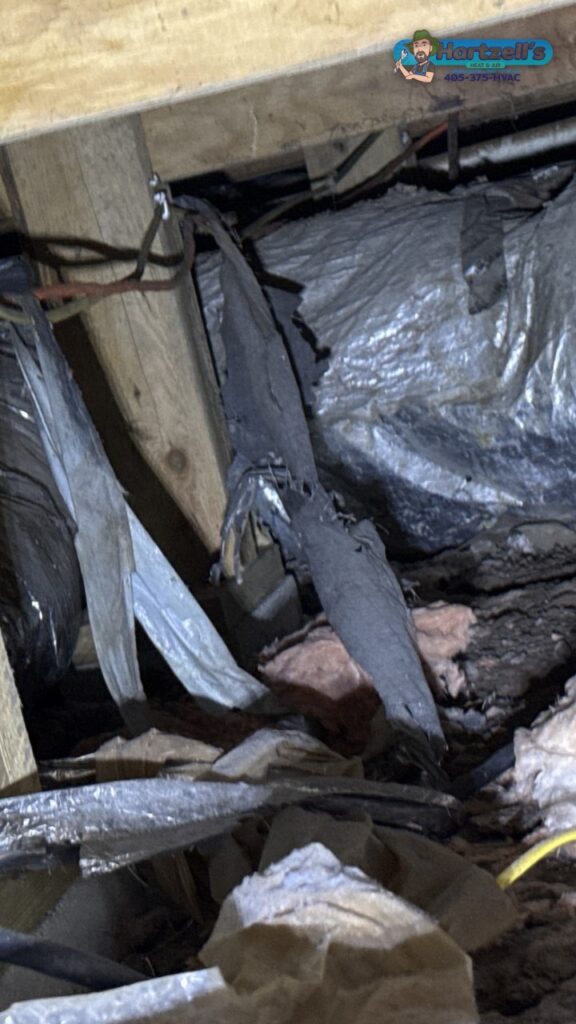 Torn and collapsed flex duct in an Okarche crawlspace, cover image for the Okarche duct replacement video