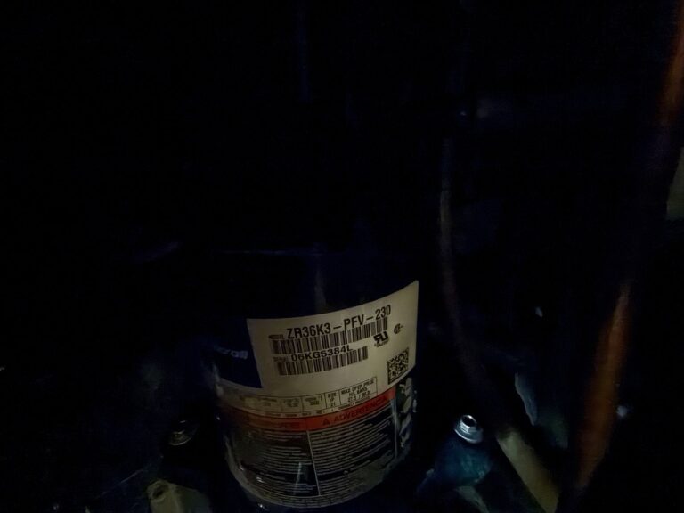 Compressor label on a geothermal heating repair in Mustang