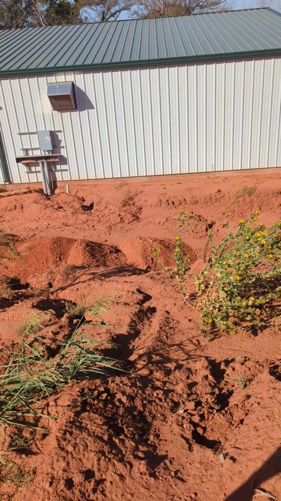 Geothermal trenches beside a metal building in Kingfisher County